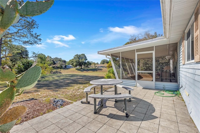 view of patio with a sunroom