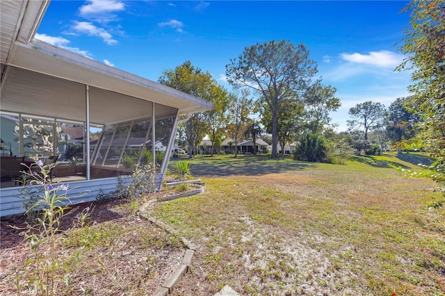 view of yard with a sunroom