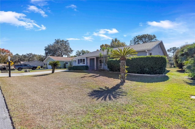 ranch-style home with a front yard