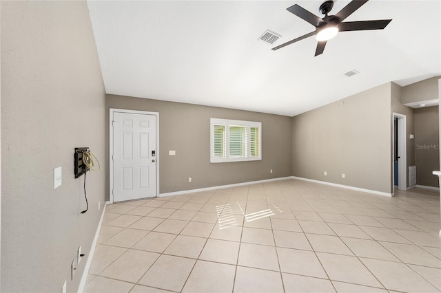 spare room featuring ceiling fan and light tile patterned floors