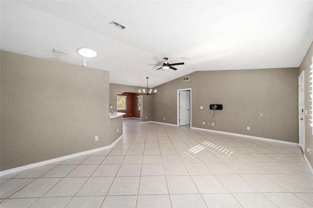 unfurnished living room featuring light tile patterned floors, ceiling fan with notable chandelier, and vaulted ceiling