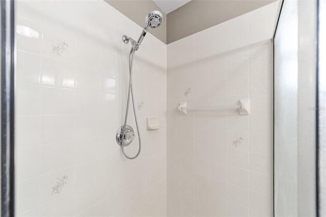 bathroom with a tile shower