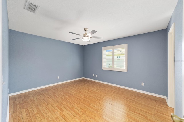 spare room with ceiling fan and light hardwood / wood-style flooring