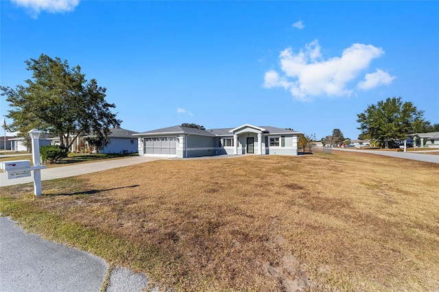 ranch-style house with a garage and a front lawn