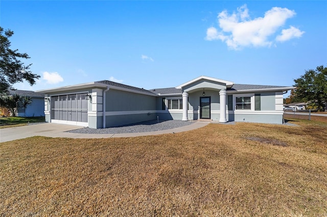 single story home with a garage and a front yard