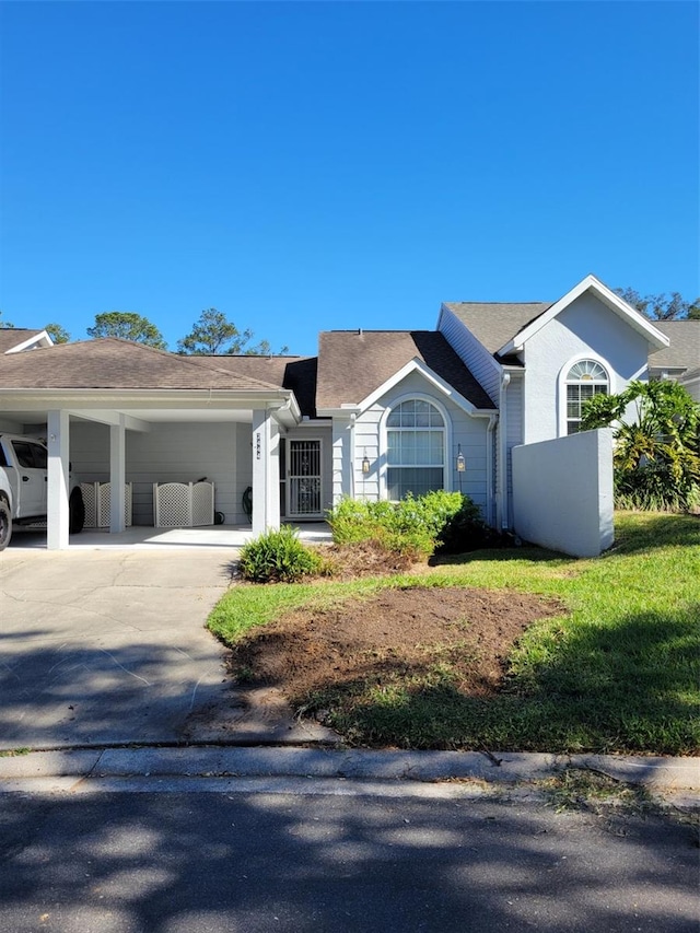 single story home with a carport and a front lawn