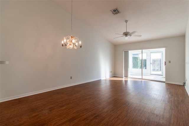 empty room with hardwood / wood-style flooring, vaulted ceiling, and ceiling fan with notable chandelier