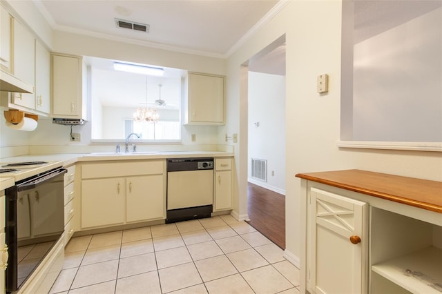 kitchen featuring cream cabinets, white electric range oven, dishwasher, and sink