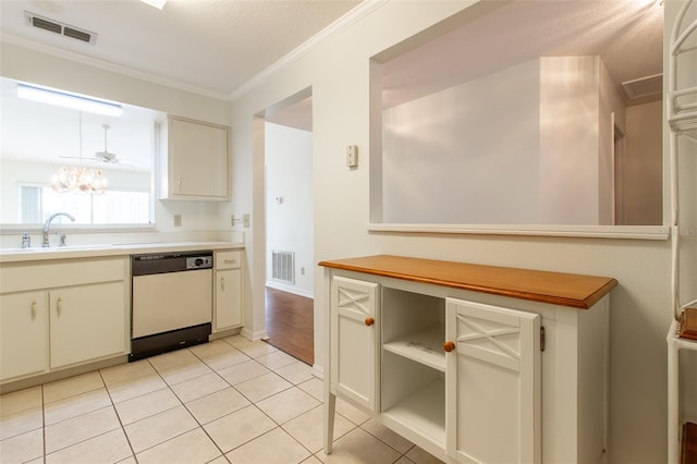 kitchen featuring sink, light tile patterned floors, dishwasher, a notable chandelier, and ornamental molding