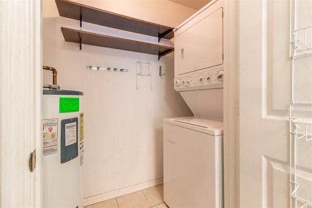 washroom with water heater, light tile patterned flooring, and stacked washer and clothes dryer