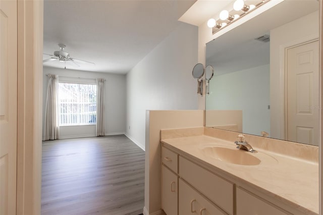 bathroom featuring ceiling fan, vanity, and hardwood / wood-style floors