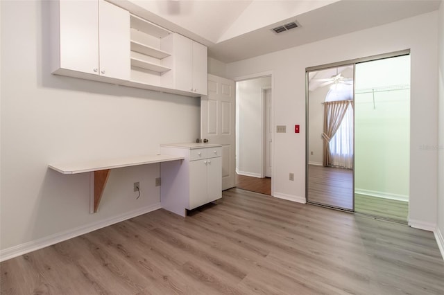 interior space with ceiling fan and light hardwood / wood-style flooring