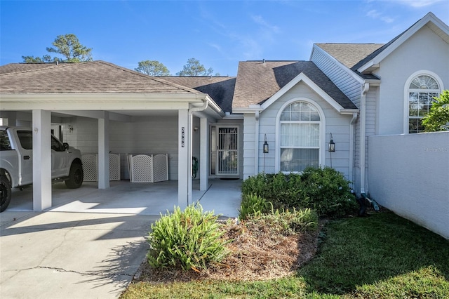 view of front of property featuring a carport