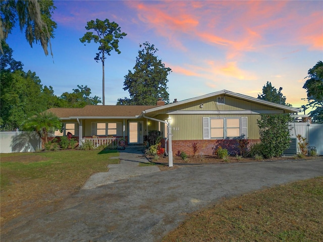 ranch-style house featuring a yard