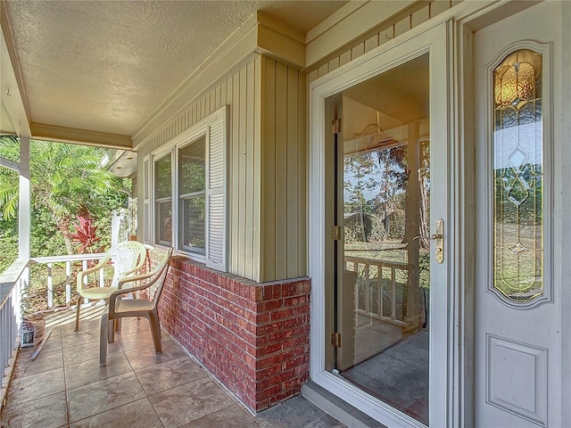 doorway to property with covered porch