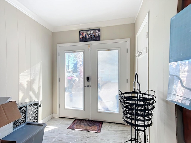 doorway featuring crown molding and french doors