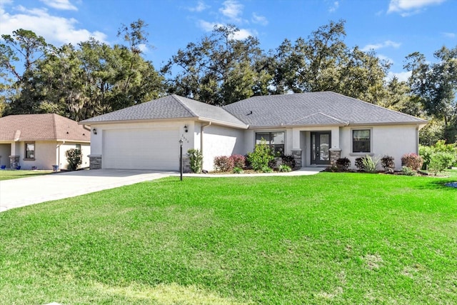 view of front of house with a front yard and a garage