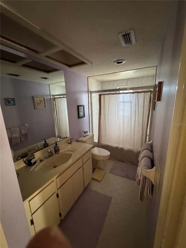 bathroom with tile patterned flooring, vanity, a shower with shower curtain, and toilet