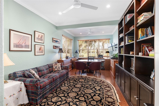 office space featuring ceiling fan, light wood-type flooring, and crown molding