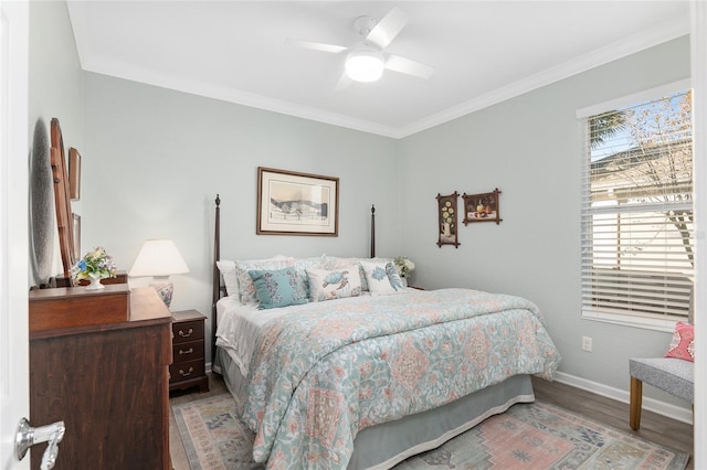 bedroom featuring wood-type flooring, ceiling fan, and ornamental molding