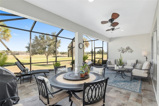 sunroom featuring ceiling fan