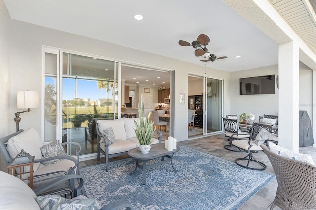 view of patio / terrace with an outdoor living space and ceiling fan