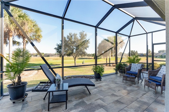 view of patio / terrace featuring glass enclosure