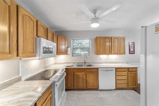 kitchen with ceiling fan, white appliances, and sink