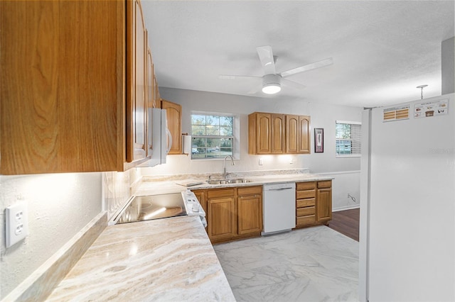 kitchen featuring ceiling fan, white appliances, and sink