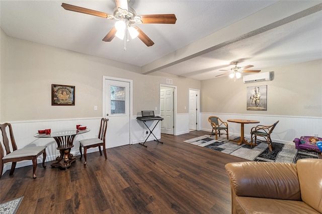 living room with an AC wall unit, ceiling fan, dark hardwood / wood-style flooring, and beam ceiling