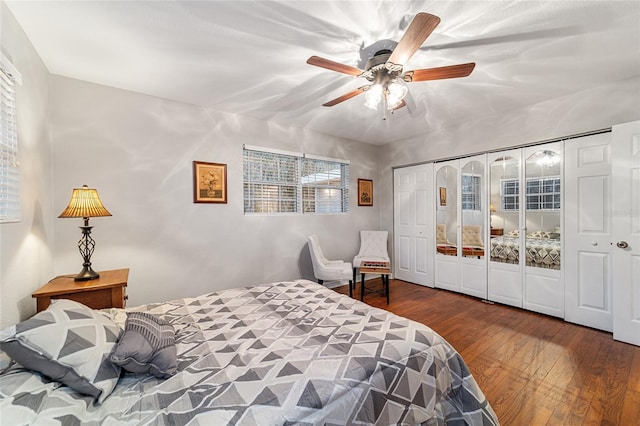 bedroom with ceiling fan, a closet, and wood-type flooring