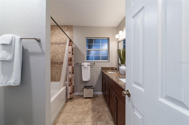 bathroom featuring tile patterned flooring, vanity, and shower / bath combo with shower curtain