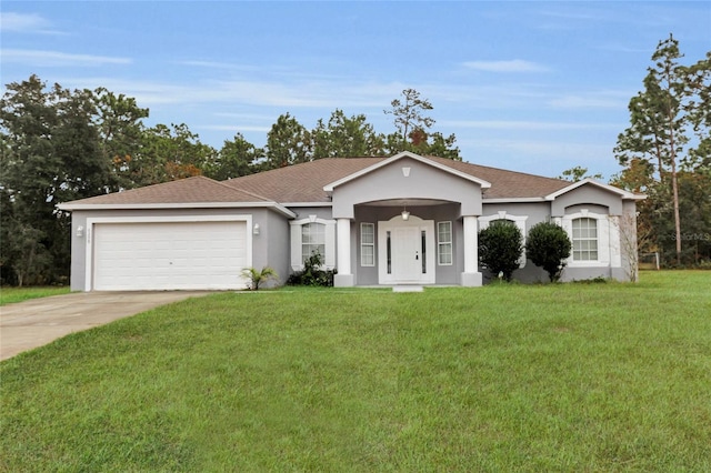 ranch-style house with a garage and a front yard