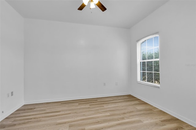 empty room with light hardwood / wood-style floors and ceiling fan