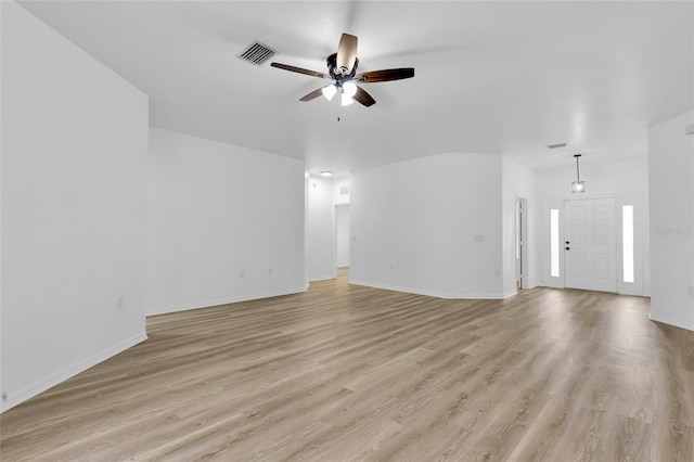 unfurnished living room featuring ceiling fan and light hardwood / wood-style flooring