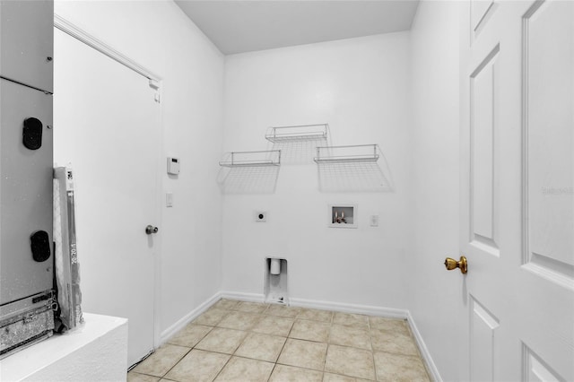 laundry room featuring washer hookup, electric dryer hookup, and light tile patterned flooring