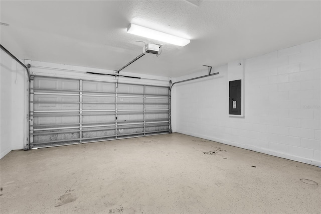 garage featuring electric panel and a garage door opener