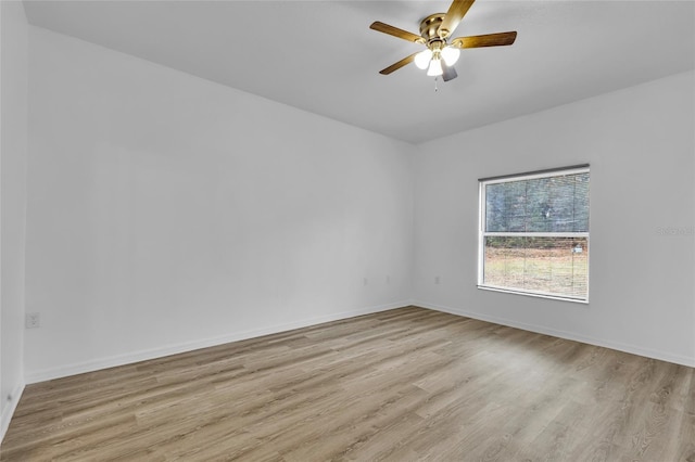 empty room featuring ceiling fan and light wood-type flooring