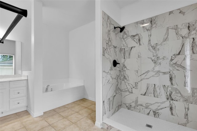 bathroom with tile patterned flooring, vanity, and separate shower and tub