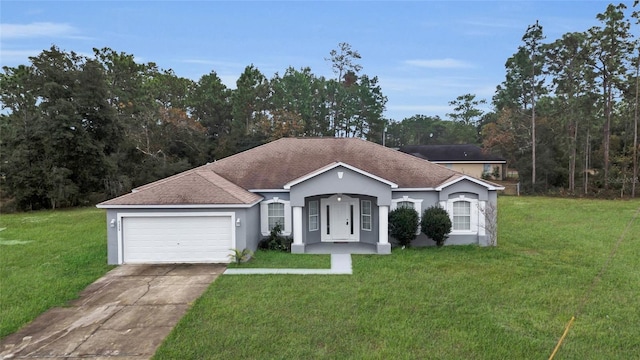 ranch-style house featuring a front lawn and a garage