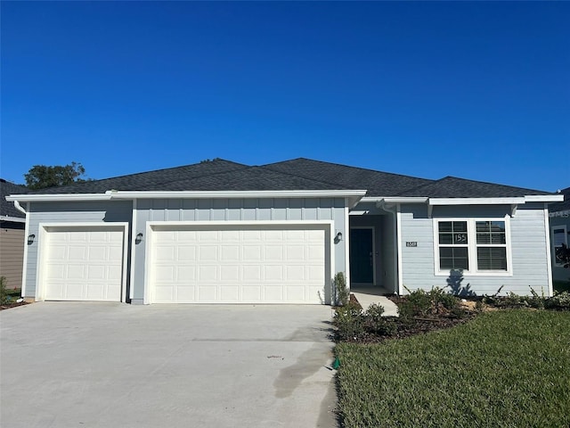 ranch-style home featuring a garage