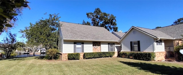 view of front of home featuring a front yard