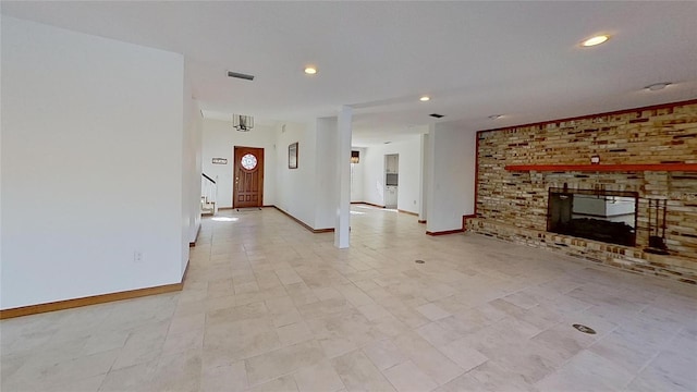 unfurnished living room with a fireplace