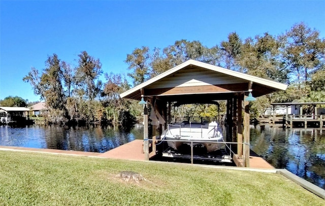 view of dock featuring a water view and a lawn