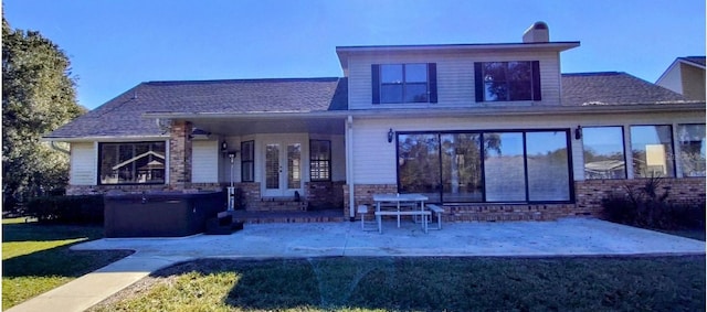 back of property with a patio area