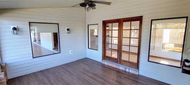 unfurnished sunroom with plenty of natural light, ceiling fan, lofted ceiling, and french doors