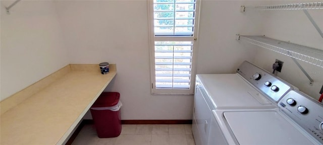 clothes washing area featuring a healthy amount of sunlight and separate washer and dryer