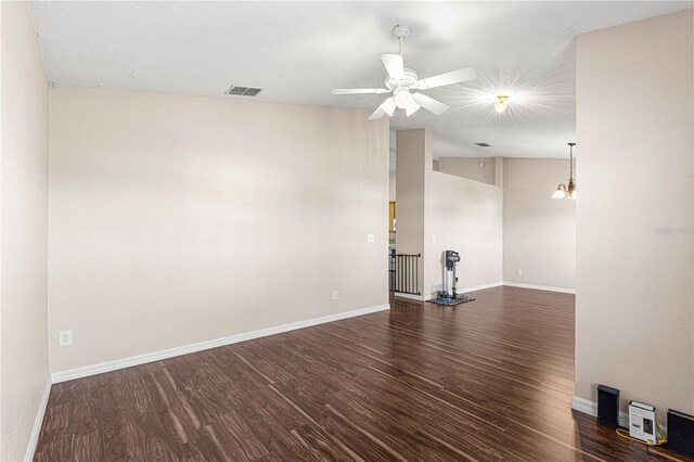 unfurnished room with dark hardwood / wood-style floors, ceiling fan, and lofted ceiling