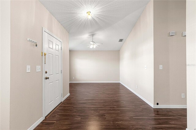 foyer with ceiling fan and dark hardwood / wood-style floors