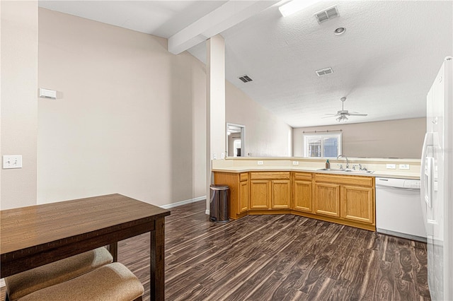 kitchen with dark hardwood / wood-style flooring, white dishwasher, ceiling fan, sink, and lofted ceiling